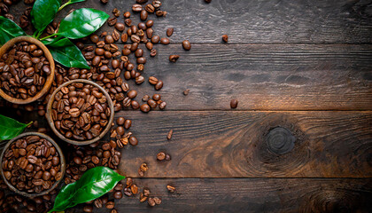 Café mania. Top view of various traditional coffee beans and leaves on a dark rustic wooden table....