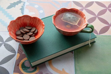 still life with a cup of tea and book