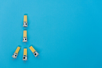 12V energy saving led bulbs spaced on a blue background. Idea concepts. Advertising or presentation...