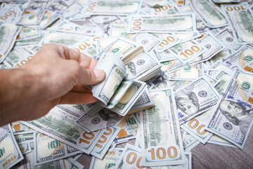 A Dollars in the hands of a businessman man guy for a trip to the rest of the shops