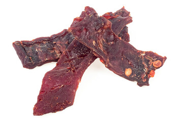 Spicy beef jerky pieces isolated on a white background. Dried jerky meat. - 755948264