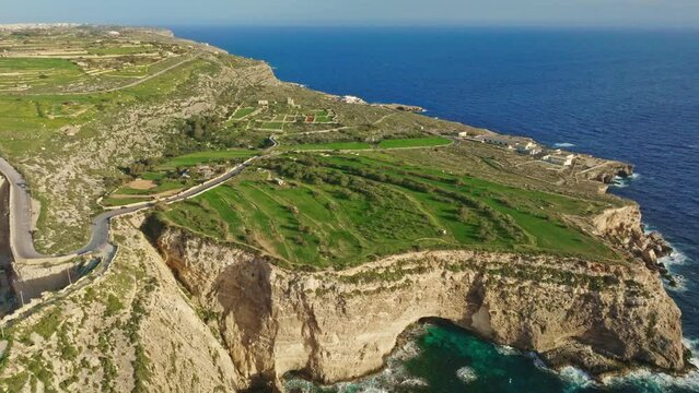 Aerial view of cliffs and green hills of Maltese island, nature landscape. Lapsi, Mediterranean sea
