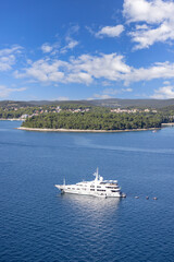 Obraz premium Aerial view from bell tower of Saint Euphemia Church of Adriatic Sea with a sailing ship, Rovinj; Croatia; Istria