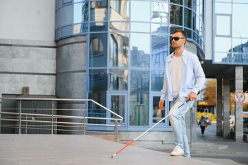 Blind man with a walking stick.