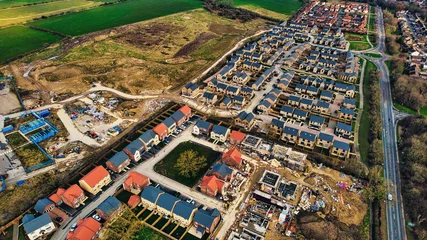 Papier Peint photo autocollant Atlantic Ocean Road Aerial view of suburban housing development with roads and green fields in Harrogate, North Yorkshire.