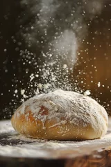 Poster A loaf of bread sprinkled with powder. Suitable for food and baking concepts. © Fotograf