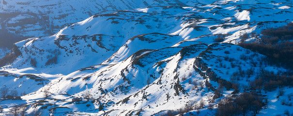 Winter landscape covered in snow in Guarguero waterfalls around port of Estacas de Trueba. Aerial...