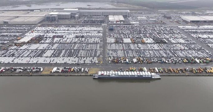 Top down aerial drone view on car and other vehicle for over seas shipping terminal in the port of Antwerp, Belgium at the Euroterminal.