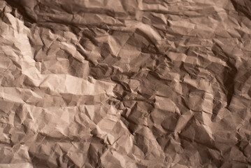 Close-Up View of a Crumpled Brown Paper Texture in Natural Light