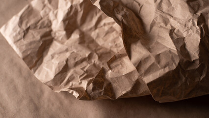 Paper from fallen leaves. Background of crumpled brown paper. Textured background from paper