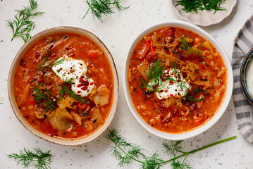 Cabbage rolls soup in a ceramic bowl on a table.  .style hugge