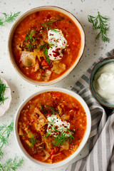 Cabbage rolls soup in a ceramic bowl on a table.  .style hugge