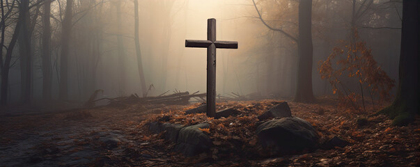 Crucifix in morning light agaisnt green autumn forest. - obrazy, fototapety, plakaty
