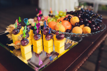 Buffet table of reception with burgers, cold snacks, meat and salads.