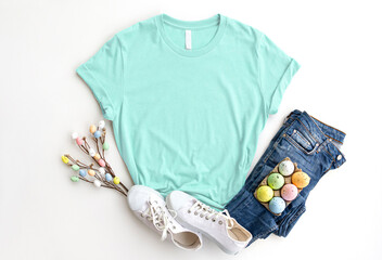 Mint cotton Tshirt mockup with easter eggs , jeans, sneakers on white background. Design mint,...