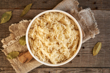 Homemade fermented cabbage or sauerkraut in a white bowl