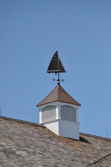 roof of the house with sailboat weathervane
