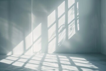 Obraz premium A simple room with white walls and a window, suitable for various concepts.