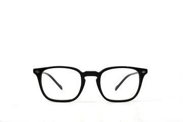 Pair of black frame glasses isolated on a plain white background. Copy space.