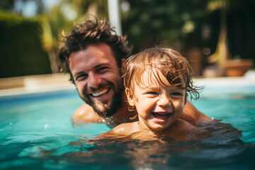 Fototapeta premium Happy Father and Son in Pool - A joyful father and his young son smiling and playing in a swimming pool. Ideal for themes of family fun, summer activities, and bonding.