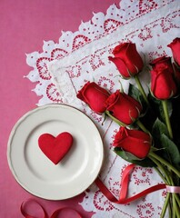 valentines day a plate with a heart on it next to a bouquet of roses 