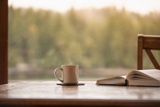 Relax at home with cup of coffee tea and book 