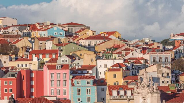 Colorful houses and residential buildings timelapse in Arroios district Lisbon, capital city of Portugal. Beautiful clouds on a background. Aerial view from Santa Justa Lift viewpoint