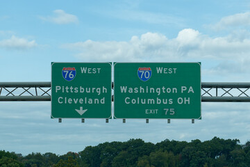 Exit 75 sign for I-70 West toward Washington PA and Columbus OH, and I-76 West toward Pittsburgh, Pennsylvania and Cleveland, Ohio