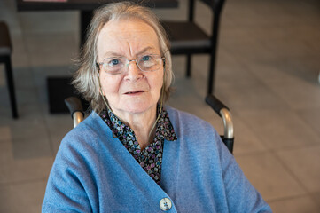 Portrait of an 85 yo white grandmother looking surprised, Tienen, Belgium