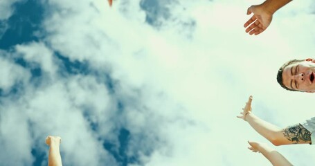 Sky, group of people and hand for team building, partnership and trust in teamwork mindset. Happy, friends and huddle of high five to support, collaboration and motivation for diversity and inclusion