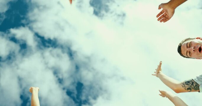 Sky, group of people and hand for team building, partnership and trust in teamwork mindset. Happy, friends and huddle of high five to support, collaboration and motivation for diversity and inclusion