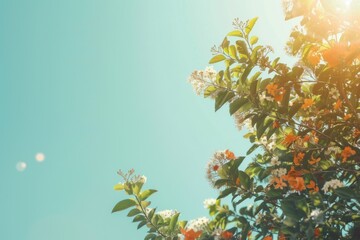 Vibrant Orange Blossoms Adorning Lush Greenery Under a Clear Blue Sky