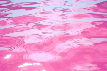 Closeup of pink transparent clear water surface texture with splashes and bubbles on sunlight. Trendy abstract summer nature background. Beauty, spa and cosmetic, travel and vacation concept
