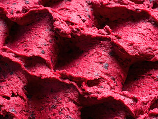 Frozen Black Currant flavour gelato - full frame detail of sorbet. Close up of a red surface...