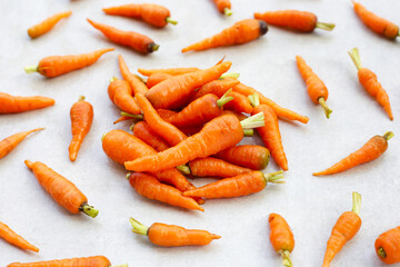 Fresh baby carrot, Excellent source of vitamin A and beta-carotene - obrazy, fototapety, plakaty