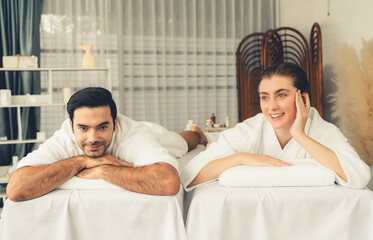 Caucasian couple customer enjoying relaxing anti-stress spa massage and pampering with beauty skin...