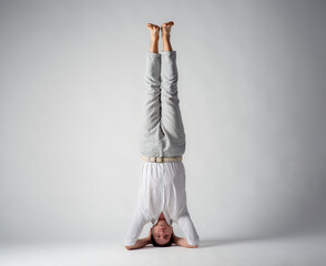 man upside down on white background with free space for text