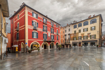 Mondovi, Italy - March 09, 2024: St. Peter's Square, view of the historic buildings decorated with...