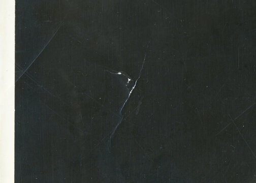 Vintage dirty grunge scan photo paper texture. Old black photo worn overlay distressed background. Vintage scratched glitch effect for design. Folded Edges. Rough grunge shabby torn ripped texture.