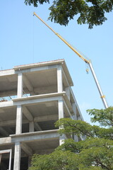 close up view of tall building under construction against sky background