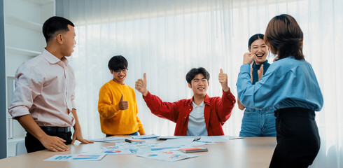 Excited and happy startup company employee celebrate after make successful strategic business...