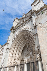 Fototapeta na wymiar Detailed view at the gothic monument building, lateral facade with ornaments, Primate Cathedral of Saint Mary of Toledo