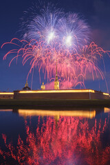 View of the Peter and Paul Fortress during the holiday and with fireworks in the sky, at night,...
