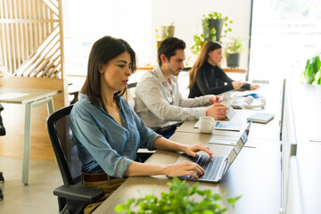 Businesspeople working in a shared space in an office