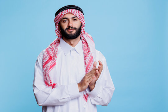 Premium Photo  Portrait of young modern muslim beauty wearing traditional islamic  clothes on plastic pink background. selective focus. high-quality photo