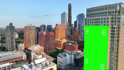 Green screen billboard in downtown New York City. Modern American urban metropolis with new, tall skyscrapers. Aerial 