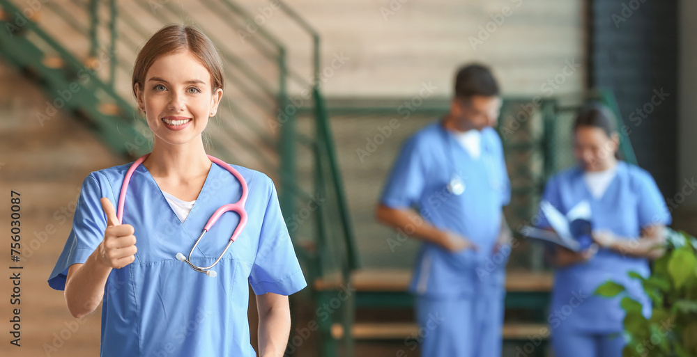 Sticker female medical student showing thumb-up in clinic