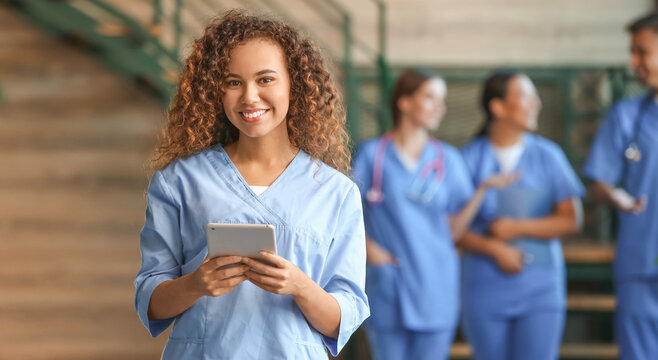 Female African-American medical student with tablet computer in clinic