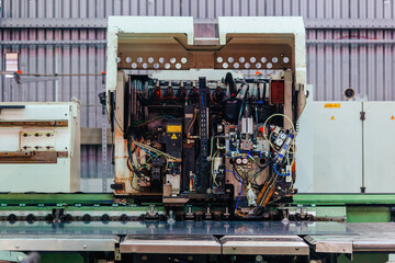 Modern CNC perforation machine in metalworking factory