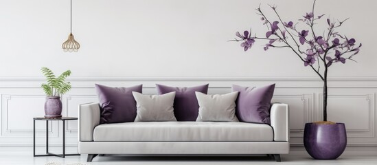 Mock-up of living room interior with gray velvet sofa, purple cushions, pendant light, vase, and...